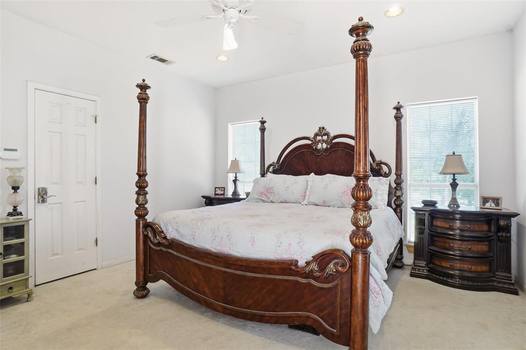 354 Jobson Road Sunnyvale, TX 75182 - Photo 27 of 39 a bedroom with a bed and dresser