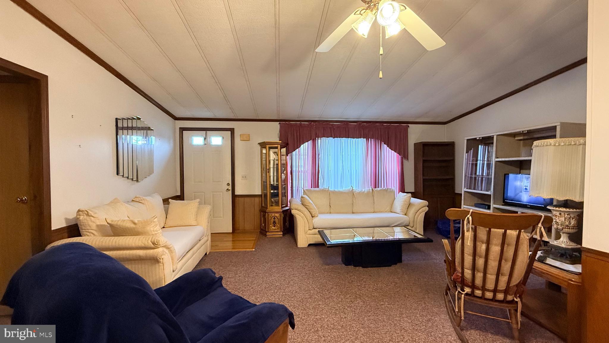 581 Miles Standish Lane Buena, NJ 08310 - Photo 15 of 34 a living room with furniture and a large window
