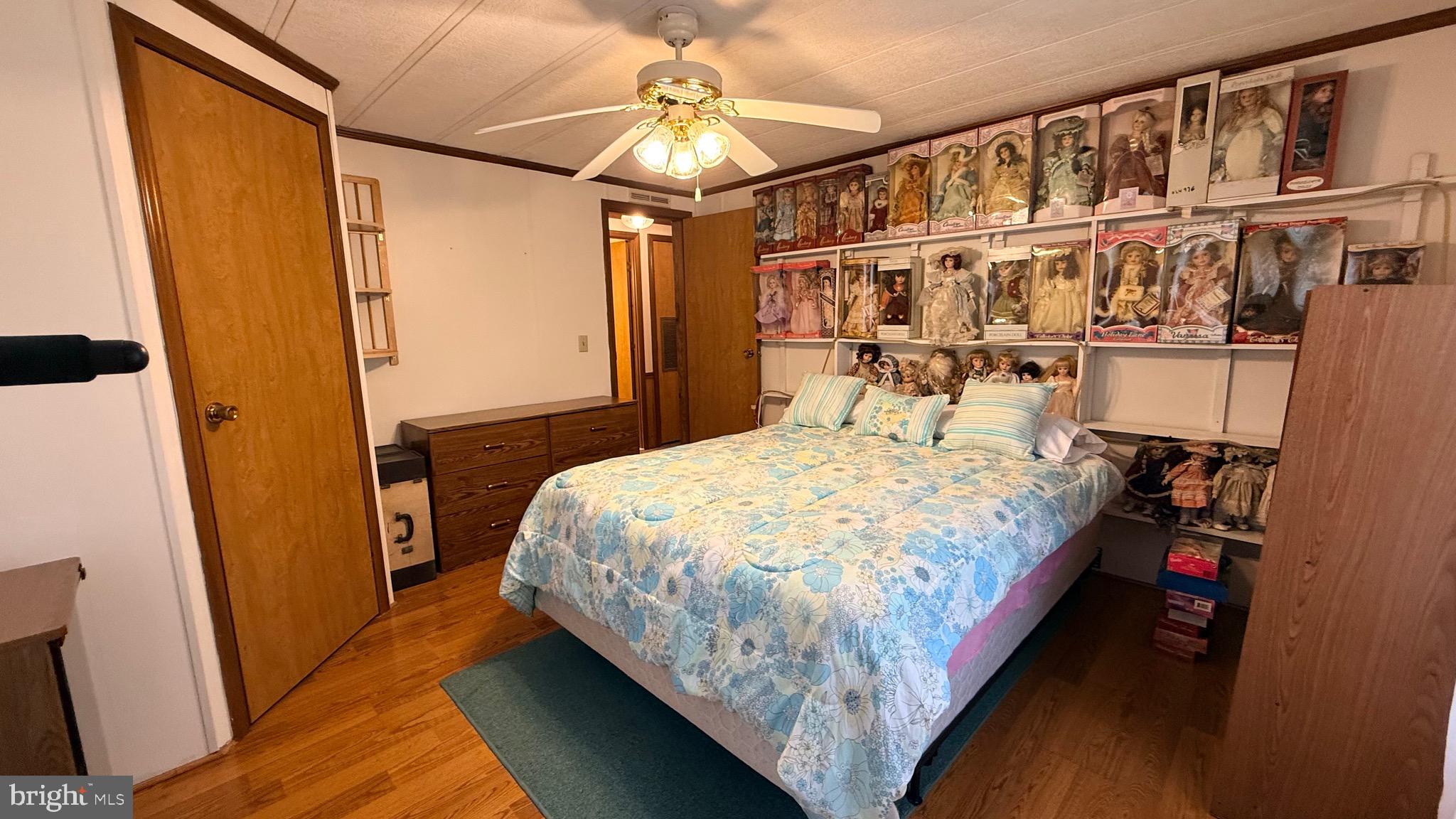 581 Miles Standish Lane Buena, NJ 08310 - Photo 20 of 34 a bed sitting in a bedroom next to a cabinet
