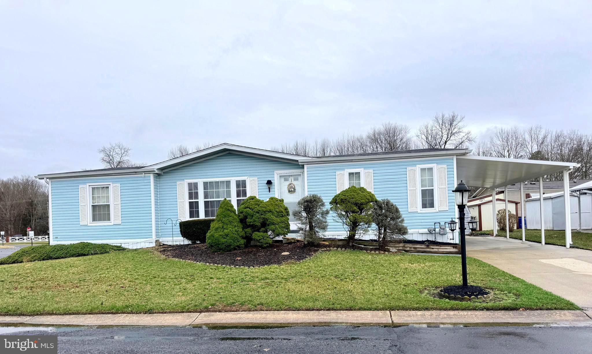 581 Miles Standish Lane Buena, NJ 08310 - Photo 2 of 34 a front view of a house with a garden