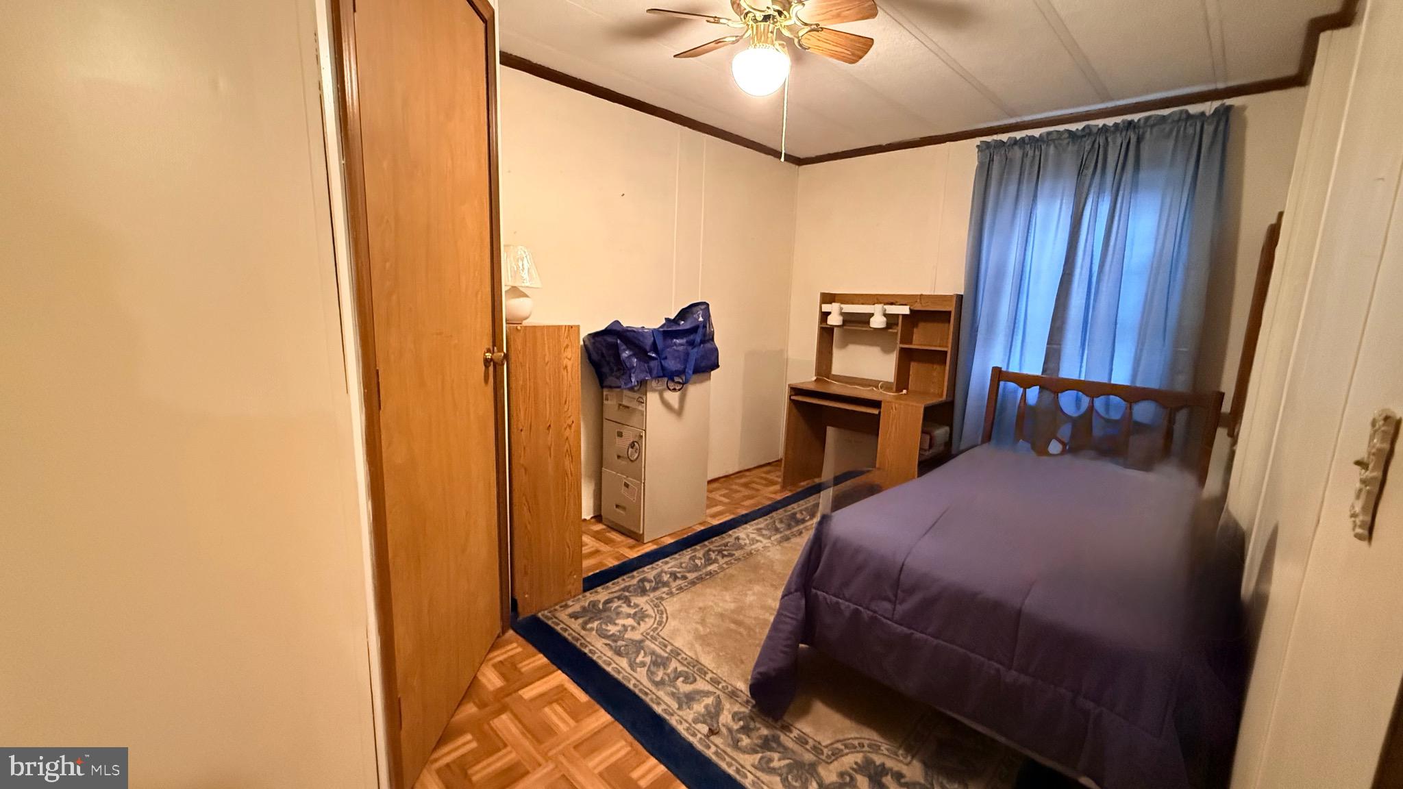 581 Miles Standish Lane Buena, NJ 08310 - Photo 21 of 34 a bedroom with a bed and a chandelier