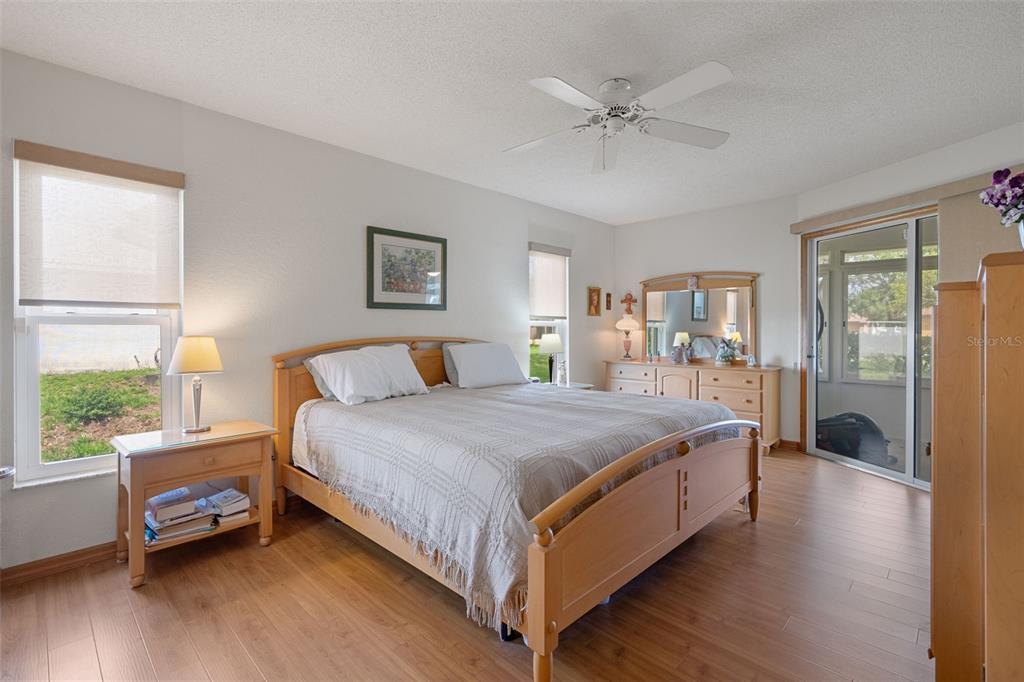 5035 Harbinger Road Spring Hill, FL 34608 - Photo 31 of 47 a spacious bedroom with a bed and a window