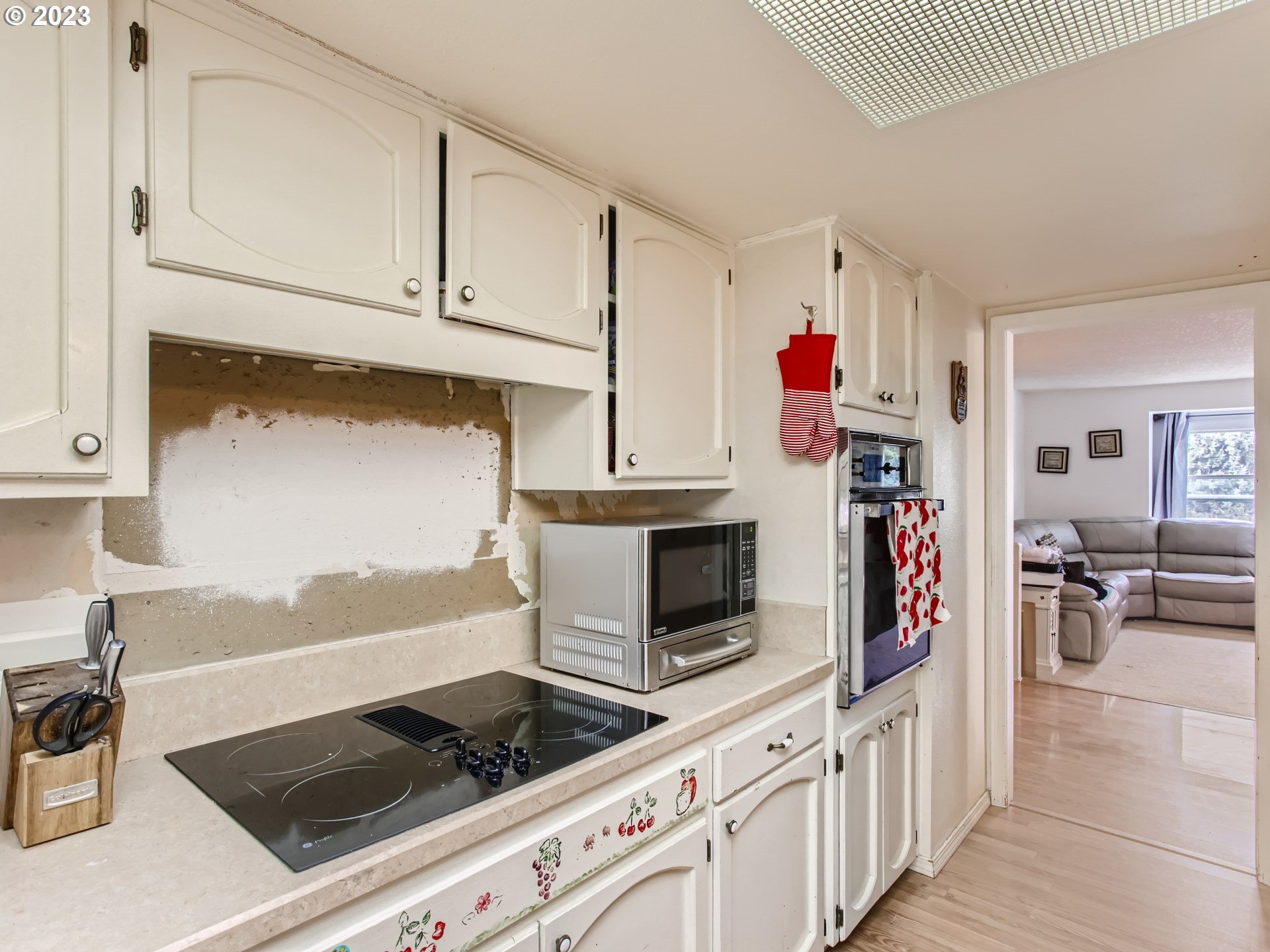 3120 Southwest Orchard Place Gresham, OR 97080 - Photo 11 of 27 a kitchen with stainless steel appliances granite countertop a stove and a sink