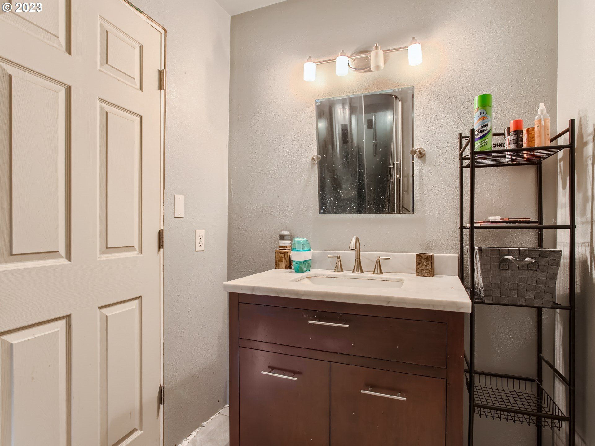 3120 Southwest Orchard Place Gresham, OR 97080 - Photo 15 of 27 a bathroom with a sink and a mirror