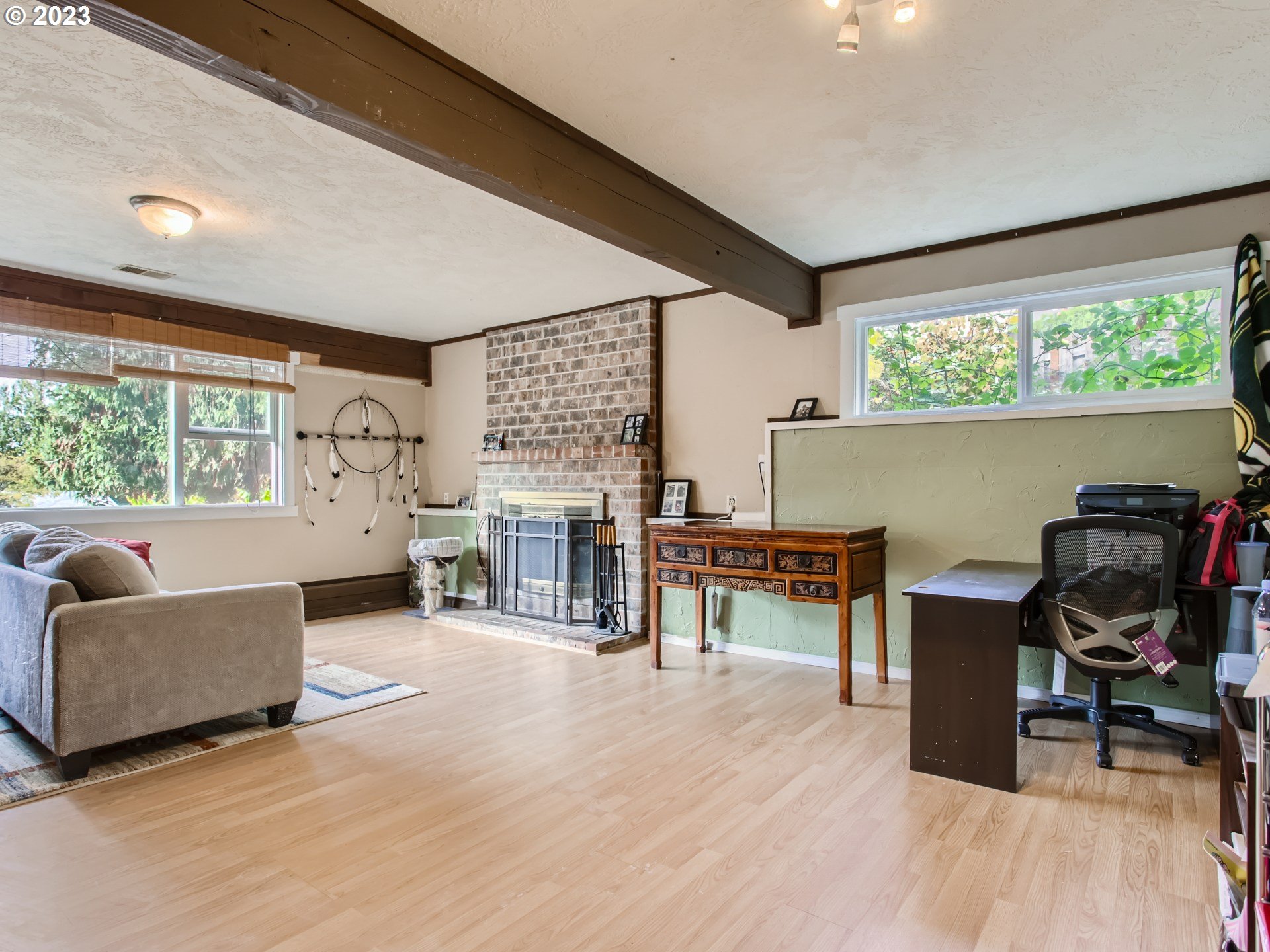 3120 Southwest Orchard Place Gresham, OR 97080 - Photo 18 of 27 a living room with furniture and a fireplace