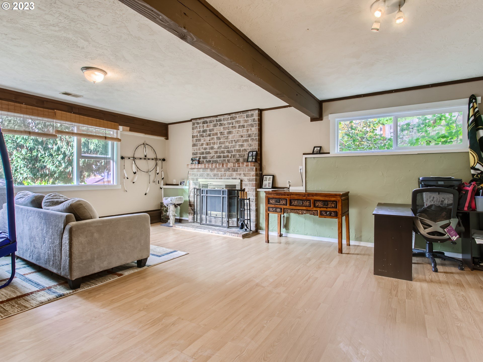 3120 Southwest Orchard Place Gresham, OR 97080 - Photo 21 of 27 a living room with furniture and a large window
