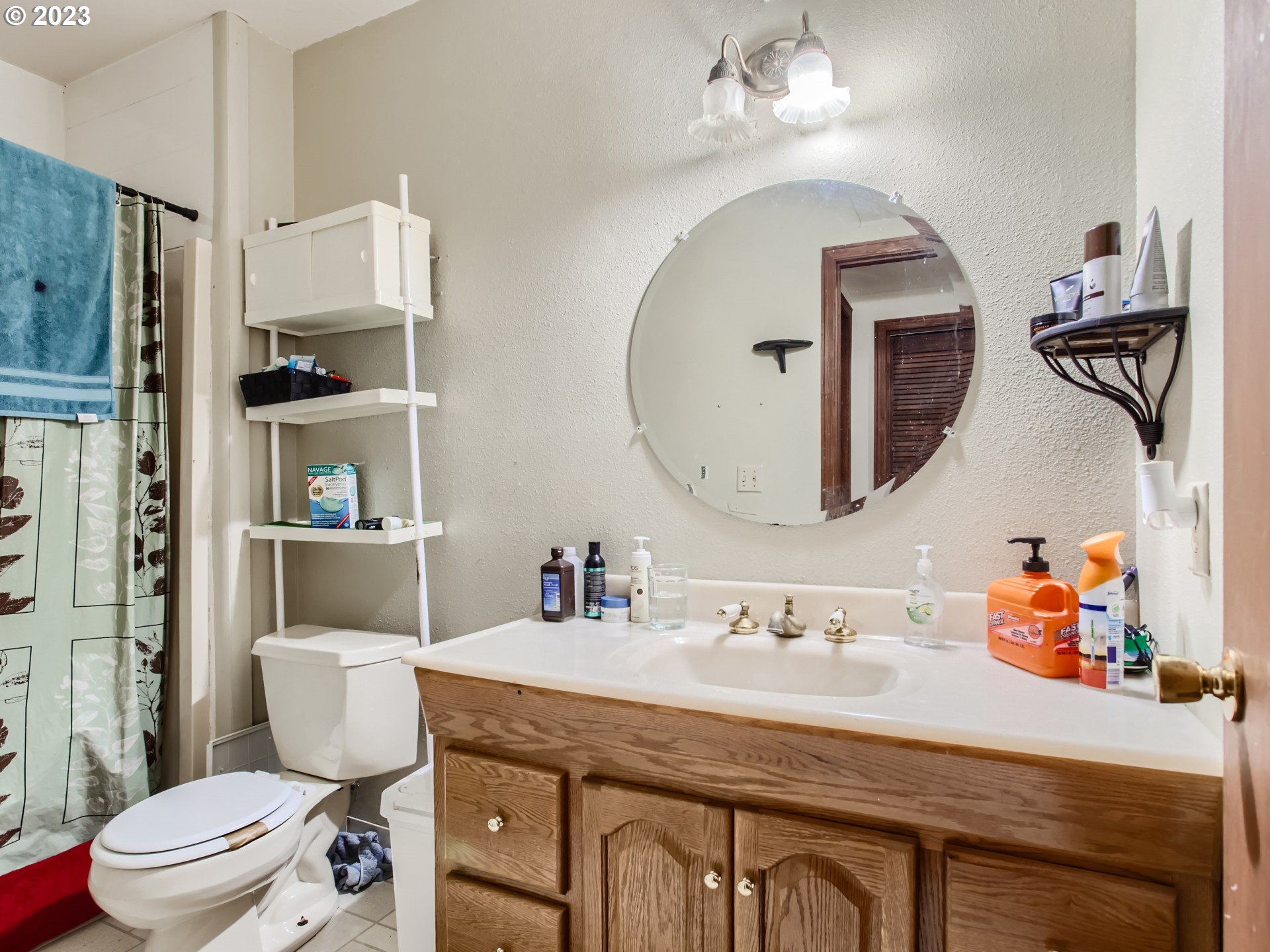 3120 Southwest Orchard Place Gresham, OR 97080 - Photo 23 of 27 a bathroom with a toilet a sink and a mirror