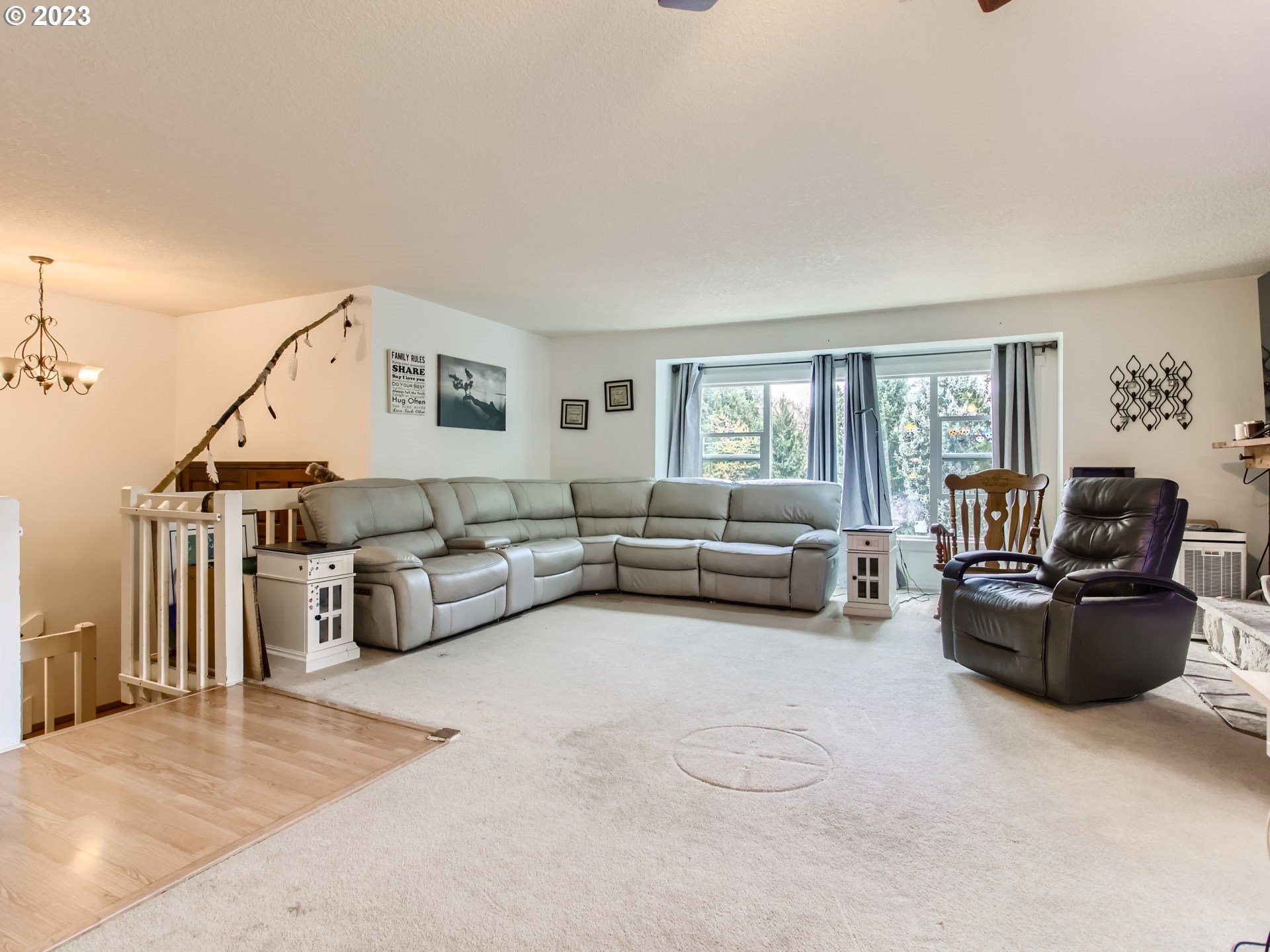 3120 Southwest Orchard Place Gresham, OR 97080 - Photo 5 of 27 a living room with furniture and a flat screen tv
