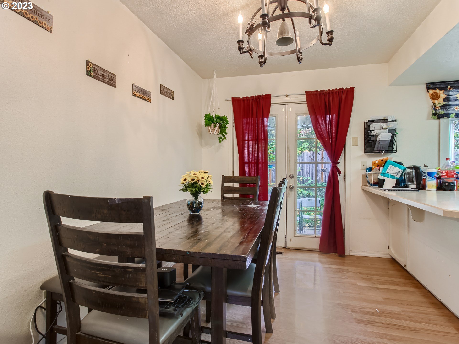 3120 Southwest Orchard Place Gresham, OR 97080 - Photo 7 of 27 a view of a dining room with furniture and wooden floor