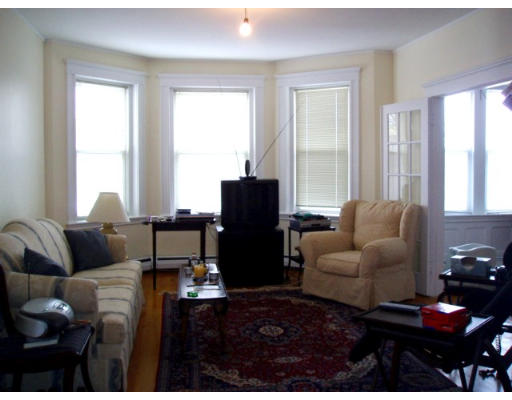 28 Addington Road, Unit 2 Brookline, MA 02445 - Photo 3 of 14 a living room with furniture and wooden floor
