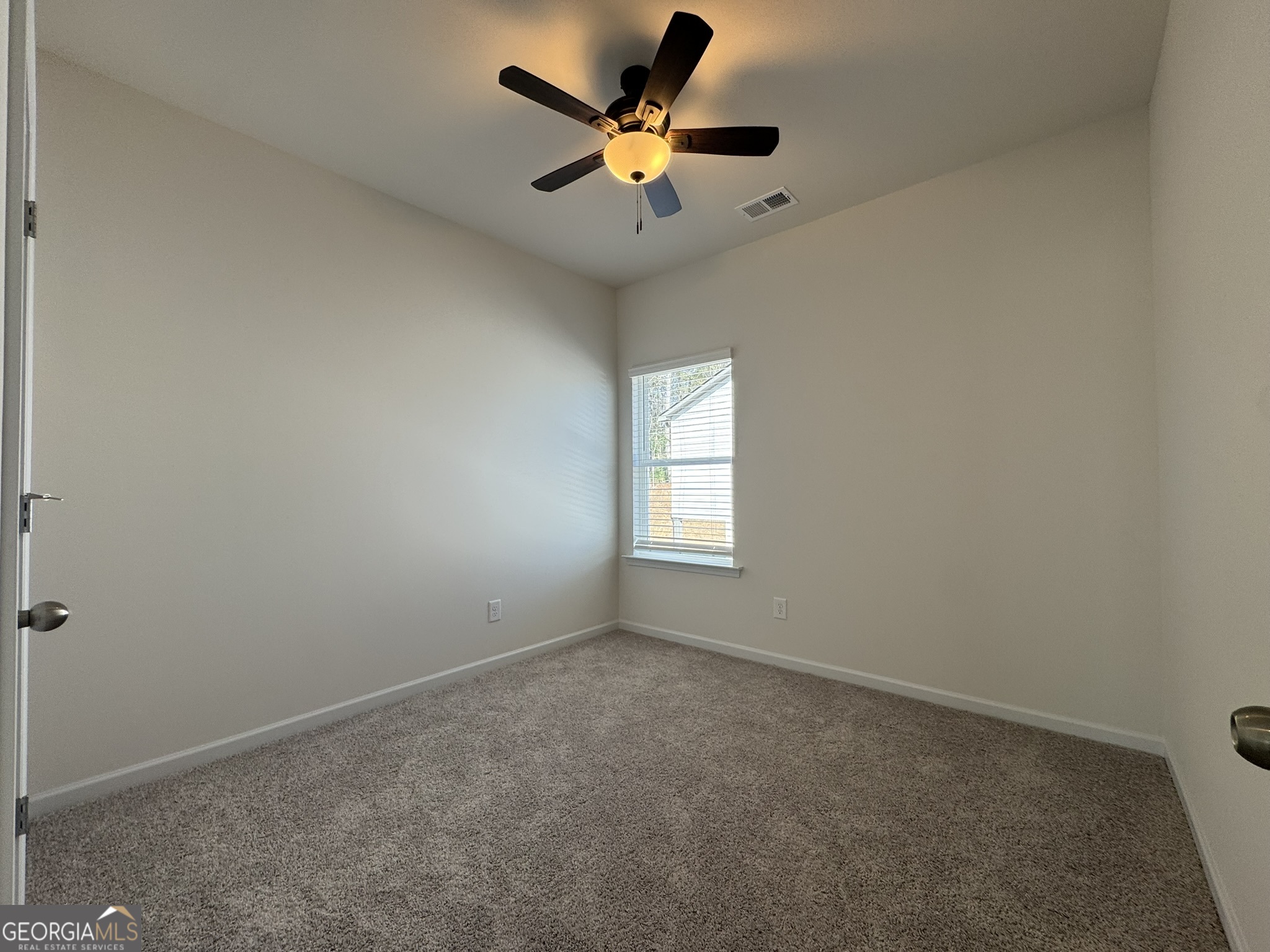 190 Fair Oak Lane Calhoun, GA 30701 - Photo 22 of 30 an empty room with windows and fan