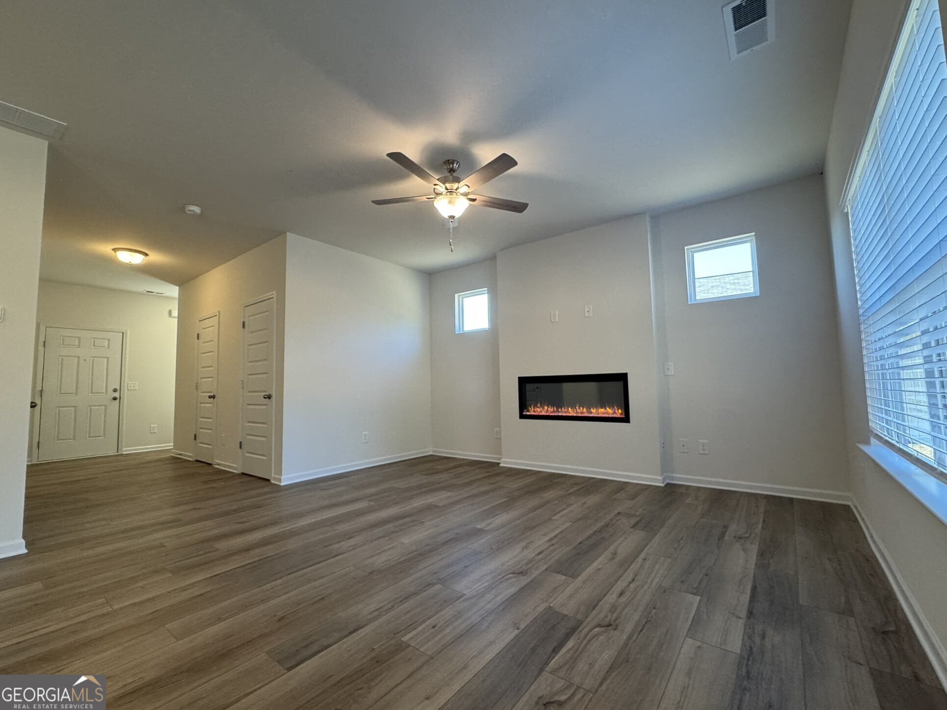 190 Fair Oak Lane Calhoun, GA 30701 - Photo 5 of 30 wooden floor in an empty room with a window