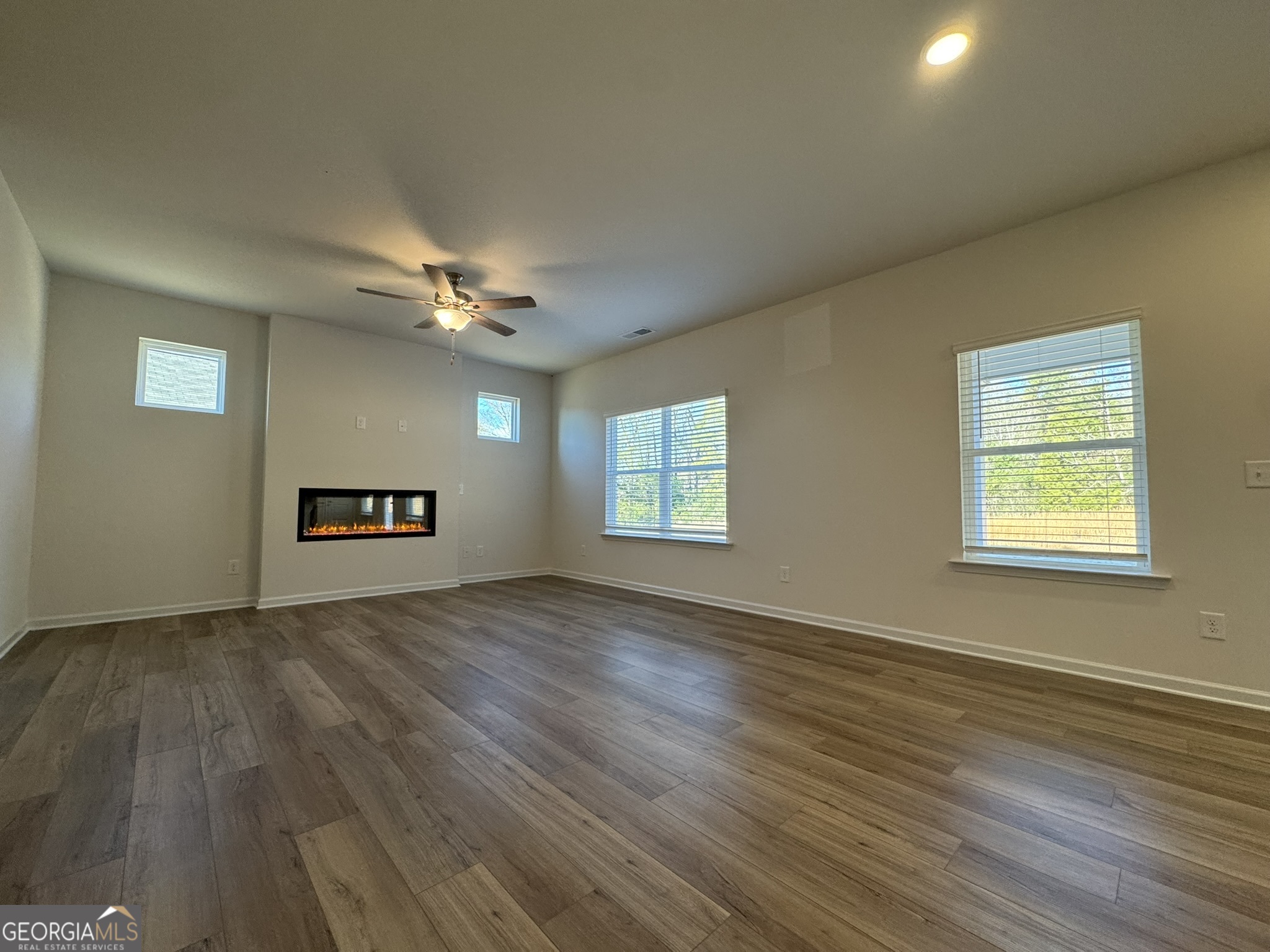 190 Fair Oak Lane Calhoun, GA 30701 - Photo 6 of 30 wooden floor in an empty room with a window