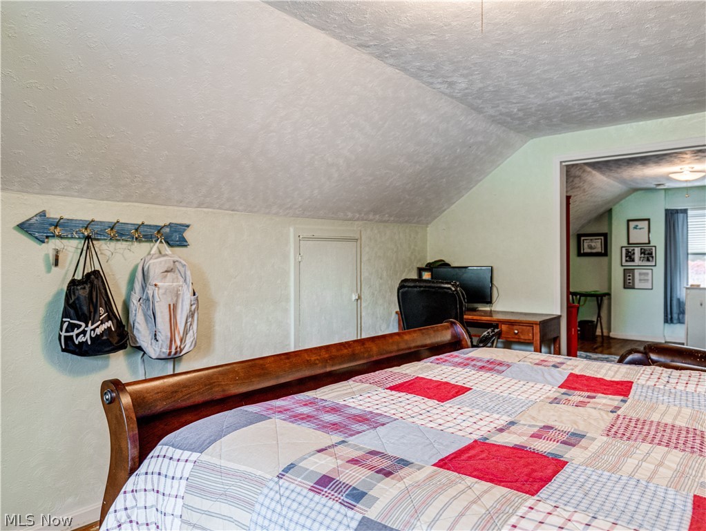 850 Ridgeview Drive Independence, OH 44131 - Photo 19 of 20 Bedroom with a textured ceiling and vaulted ceiling