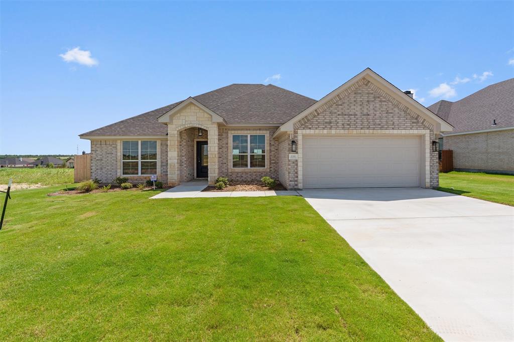 1341 Promised Land Road Hewitt, TX 76643 - Photo 29 of 29 Stone and brick exterior with a dark shingle roof