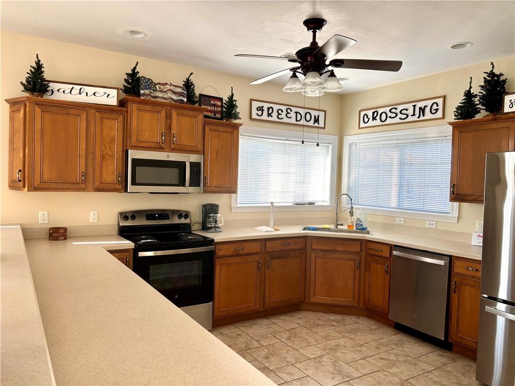 516 Madison Boulevard Freedom, PA 15042 - Photo 34 of 36 a kitchen with a sink stainless steel appliances and cabinets
