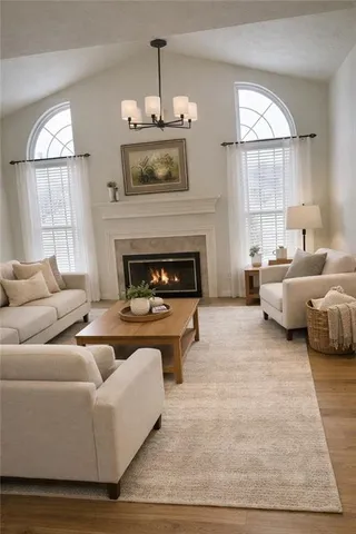a living room with furniture window and a fireplace