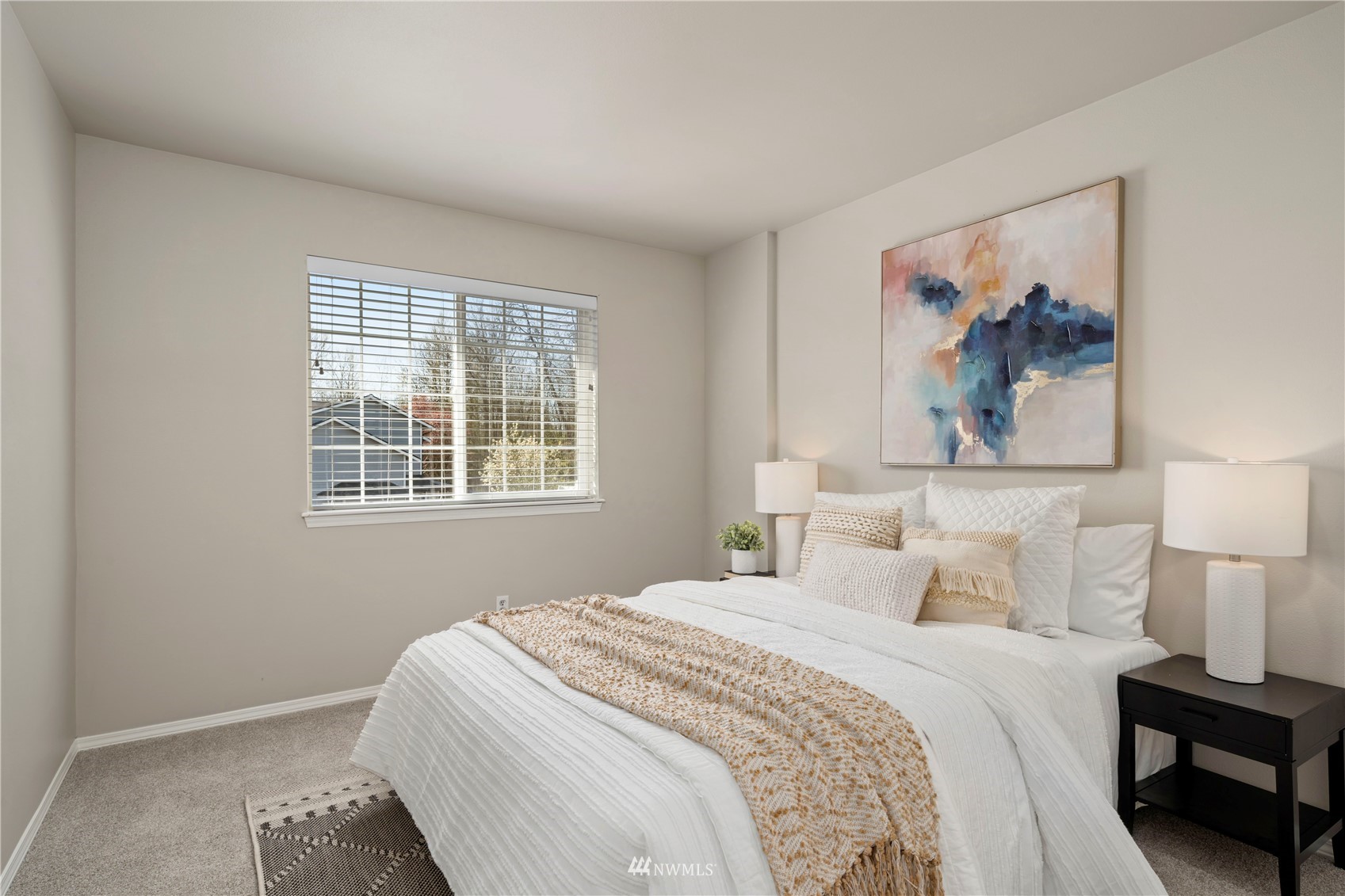 4518 Northeast 7th Place Renton, WA 98059 - Photo 13 of 24 a bedroom with a bed and a painting on the wall