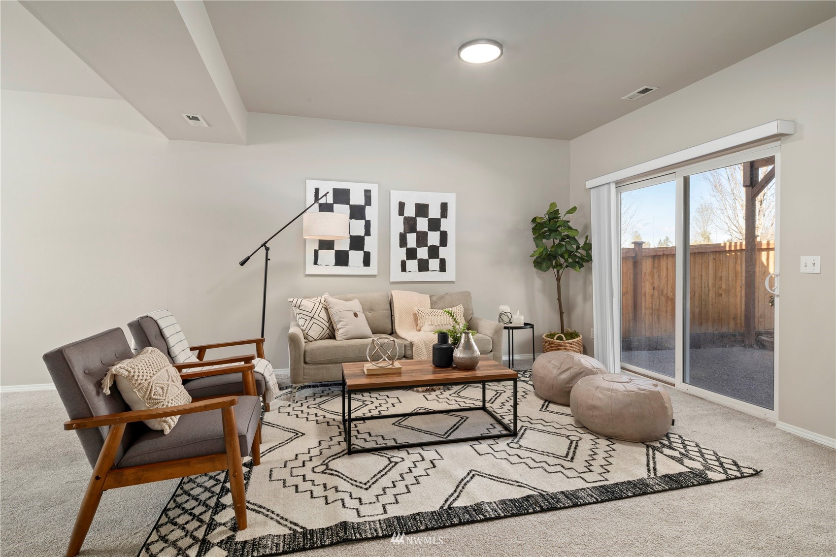 4518 Northeast 7th Place Renton, WA 98059 - Photo 16 of 24 a living room with furniture and a rug