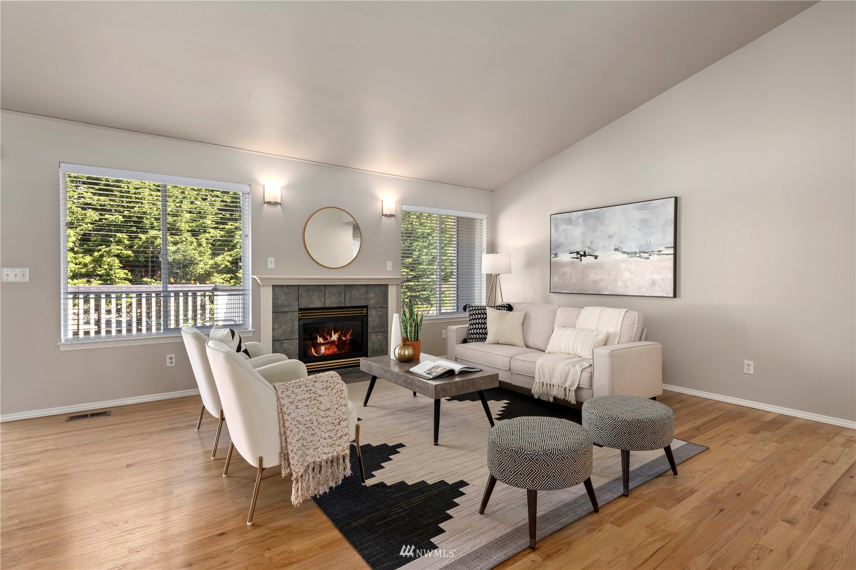 4518 Northeast 7th Place Renton, WA 98059 - Photo 2 of 24 a living room with furniture a fireplace and a large window