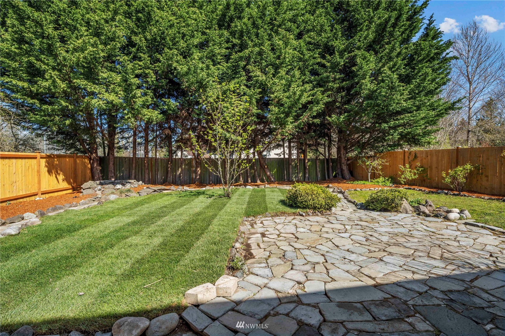 4518 Northeast 7th Place Renton, WA 98059 - Photo 23 of 24 a view of a backyard with a garden