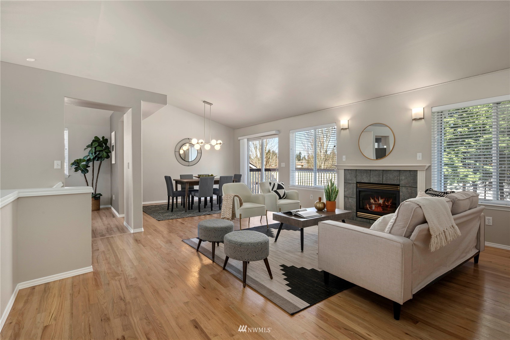 4518 Northeast 7th Place Renton, WA 98059 - Photo 4 of 24 a living room with furniture and a fireplace