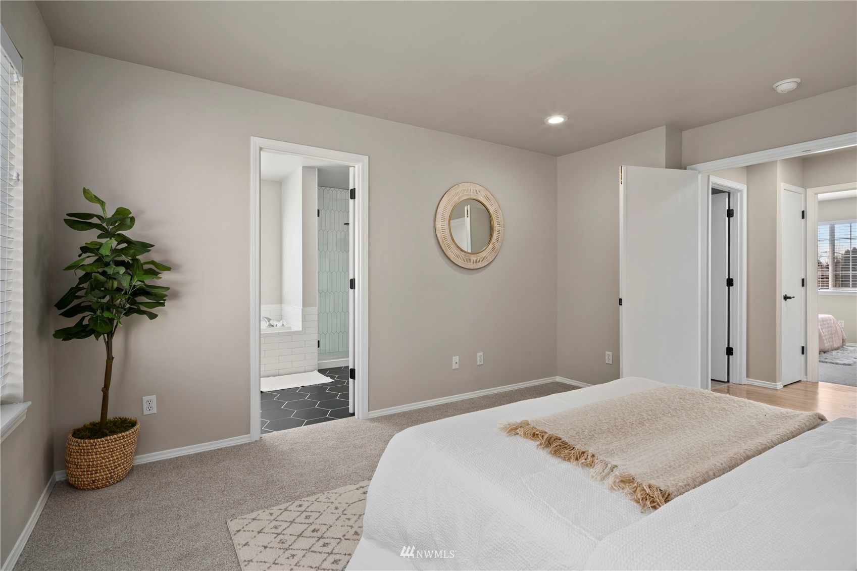 4518 Northeast 7th Place Renton, WA 98059 - Photo 9 of 24 a bedroom with a bed and a potted plant