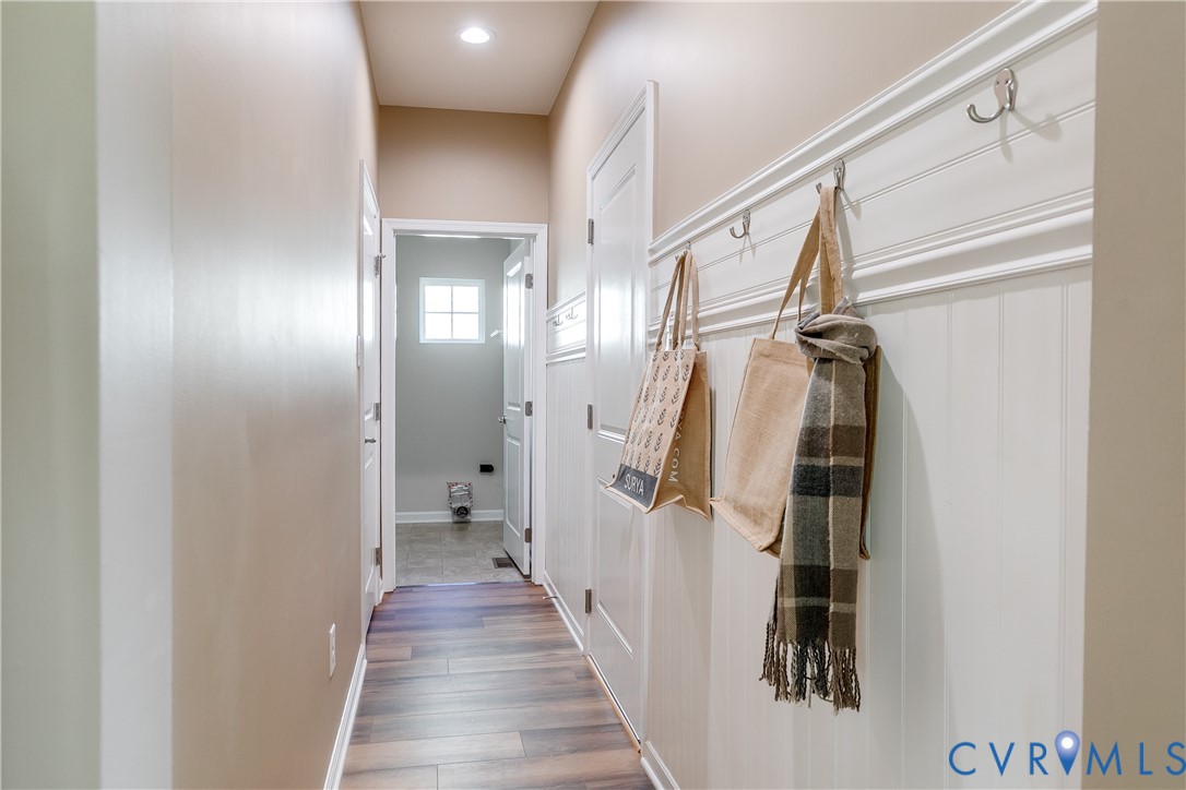 7538 South Franklins Way Quinton, VA 23141 - Photo 36 of 48 a view of hallway with stairs and a wooden floor