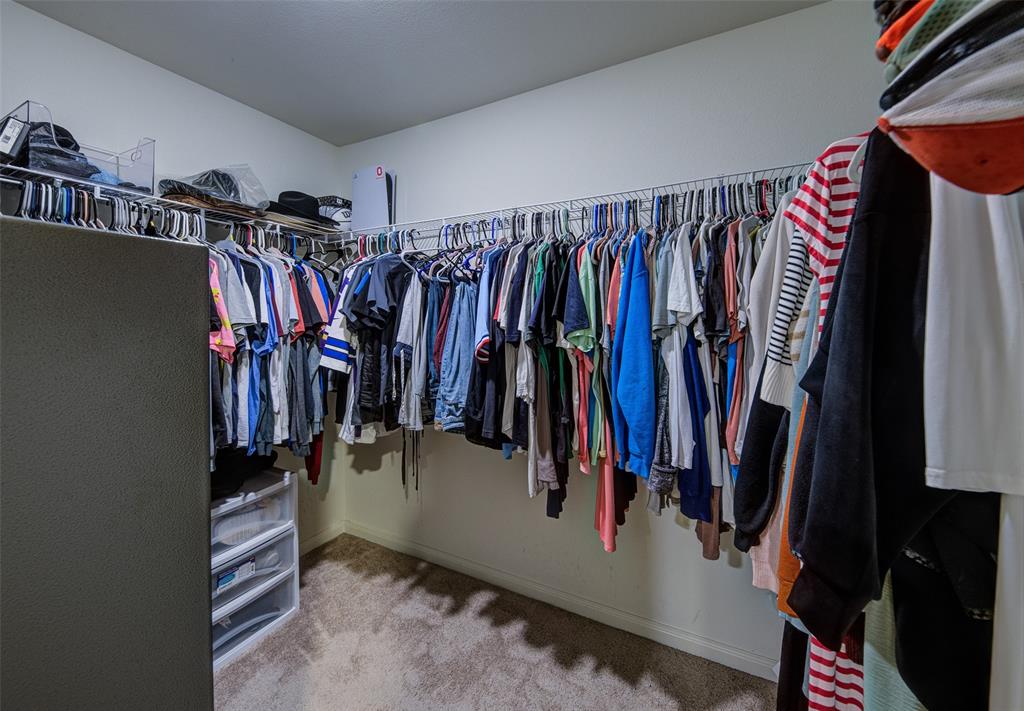 3003 Watercrest Drive Sanger, TX 76266 - Photo 17 of 21 a view of walk in closet with clothes