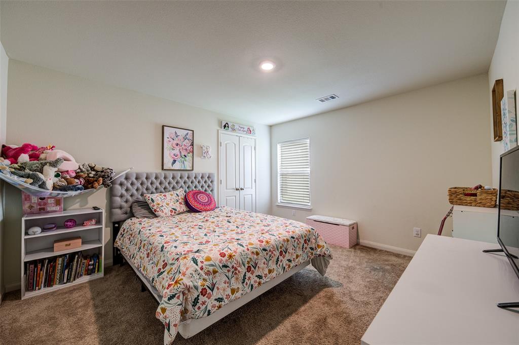 3003 Watercrest Drive Sanger, TX 76266 - Photo 18 of 21 a bedroom with a bed and a dresser