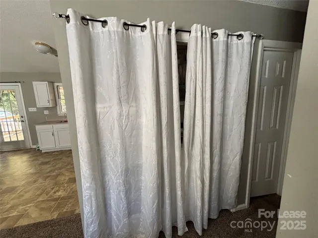 a view of walk in closet with window