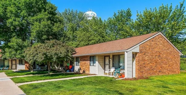a view of a house with a yard and plants