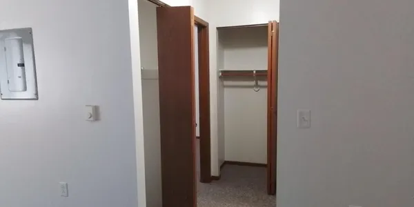 a bedroom with a bed and a table in it