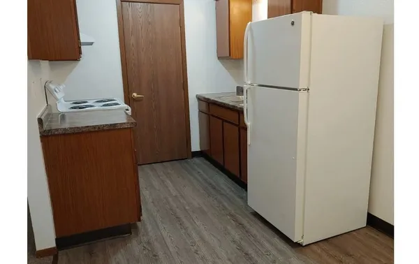 a white toilet sitting next to a bath tub