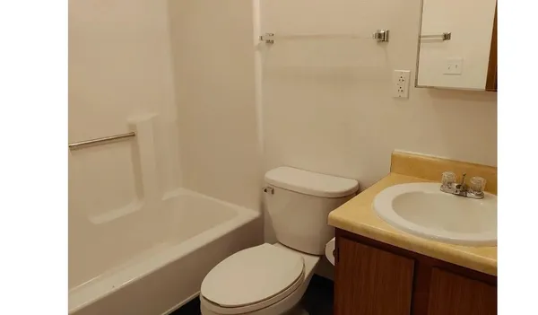 a bathroom with a bathtub and a sink
