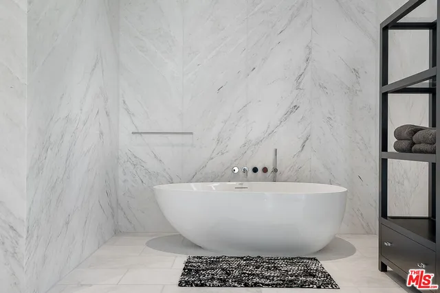 a white bath tub sitting in a bathroom
