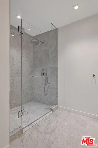 a view of a livingroom with furniture and mirror