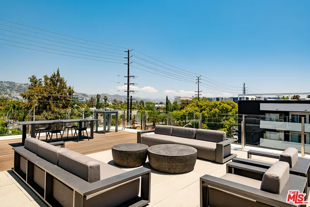 a view of a patio with couches table and chairs