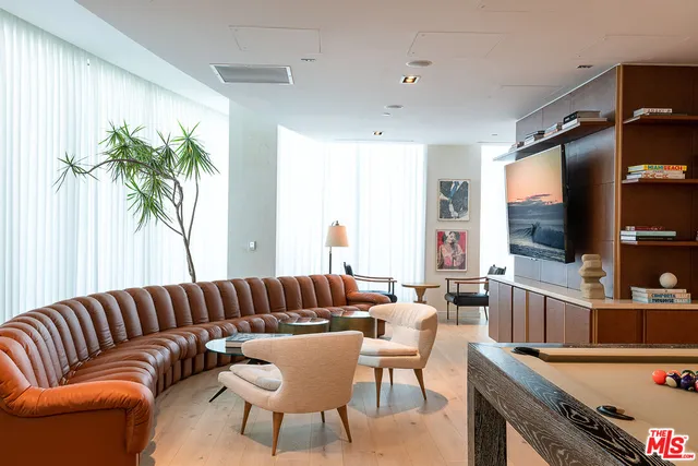 a backyard of a house with chairs