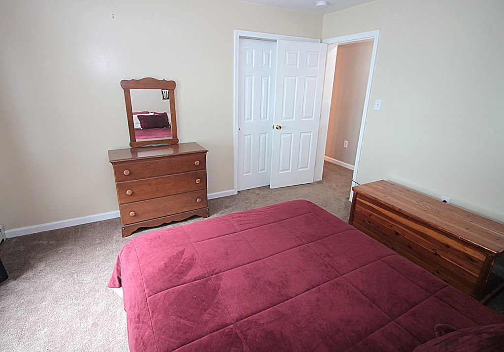 65 High Street Erving, MA 01344 - Photo 18 of 39 a bedroom with a bed and a dresser