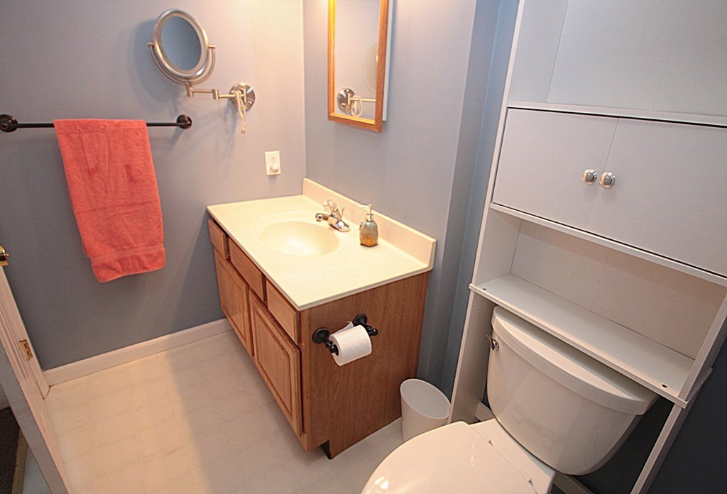 65 High Street Erving, MA 01344 - Photo 20 of 39 a bathroom with a sink mirror vanity and toilet