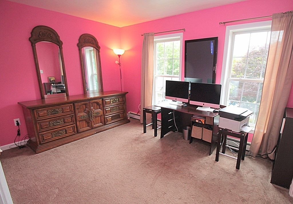 65 High Street Erving, MA 01344 - Photo 23 of 39 a room with furniture and a flat screen tv