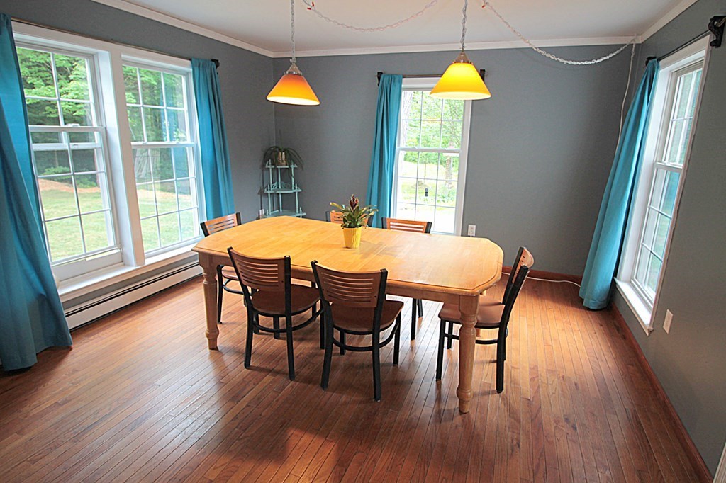 65 High Street Erving, MA 01344 - Photo 9 of 39 a dining room with furniture a chandelier and wooden floor