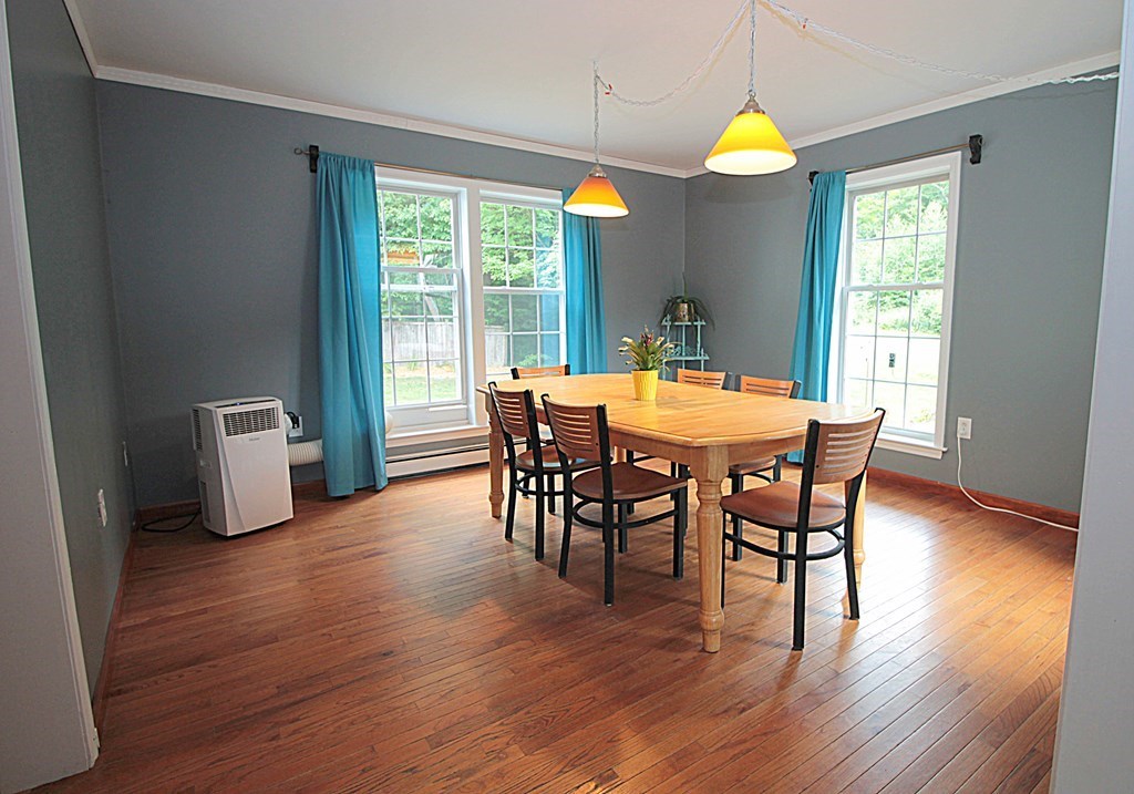 65 High Street Erving, MA 01344 - Photo 10 of 39 a view of a dining room with furniture and wooden floor