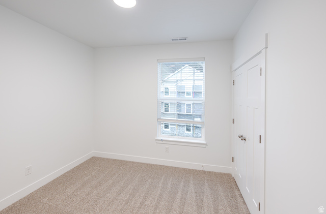 4661 Poplar Way, Unit R302 Mapleton, UT 84664 - Photo 7 of 17 Unfurnished bedroom with light carpet and a closet