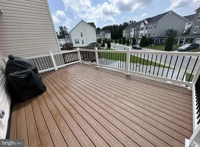 a view of a balcony with wooden floor