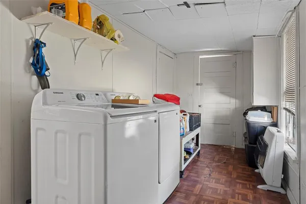 a utility room with dryer and washer