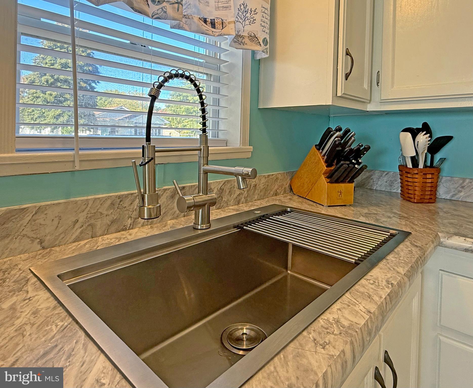 27137 Clipper Road, Unit M55 Millsboro, DE 19966 - Photo 11 of 48 a kitchen with a sink and a window