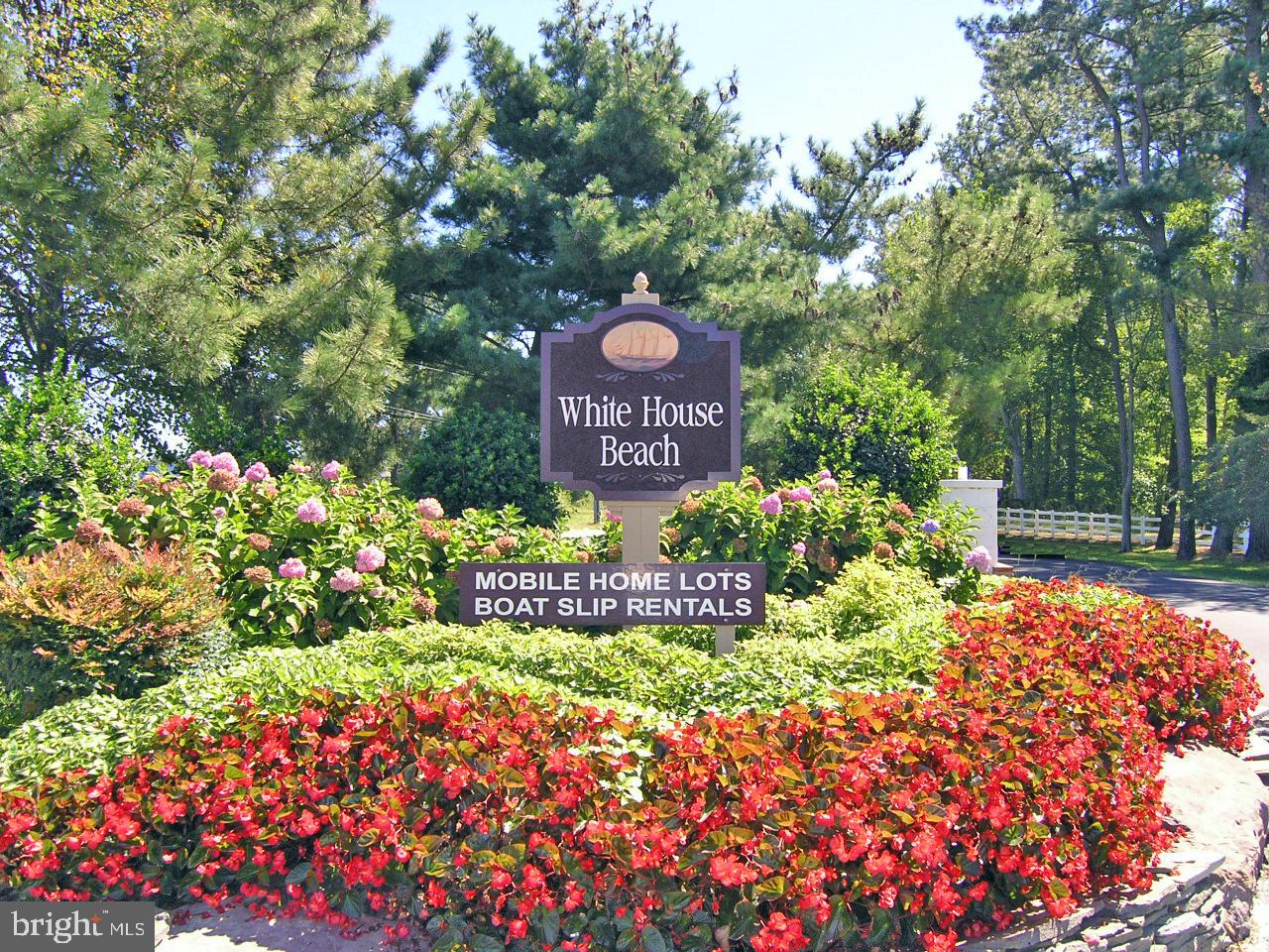 27137 Clipper Road, Unit M55 Millsboro, DE 19966 - Photo 2 of 48 a view of sign board with yard