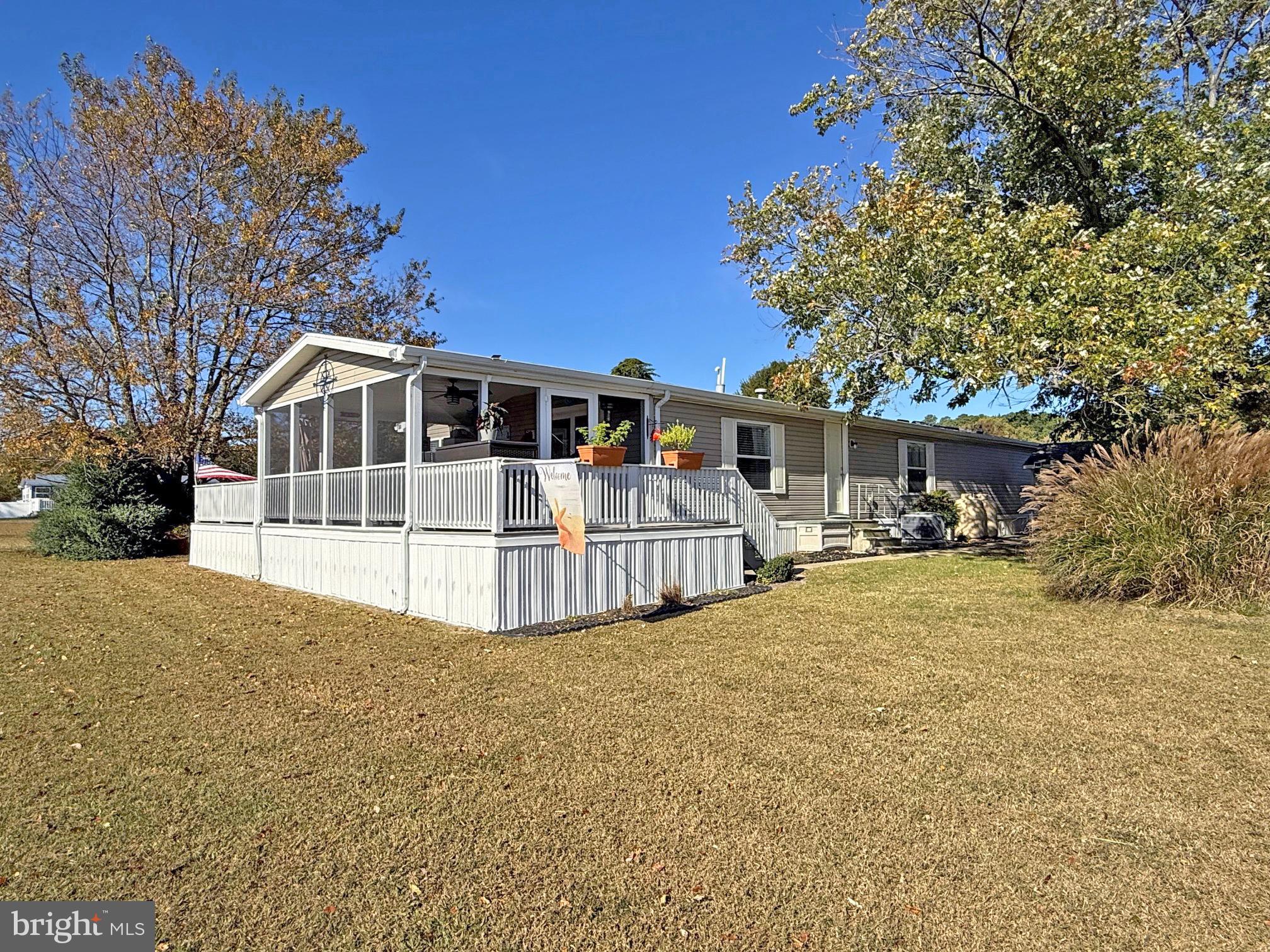 27137 Clipper Road, Unit M55 Millsboro, DE 19966 - Photo 22 of 48 a view of house with a yard
